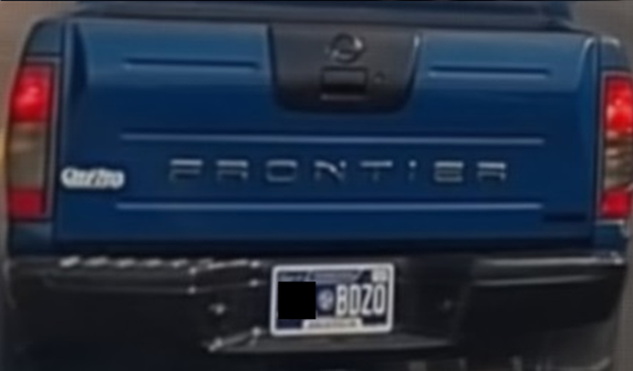 Sharp focused image of the back of a blue truck.